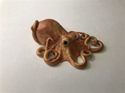 Golden octopus polymer clay sculpture. www.mymythicalpets.com | Polymer clay sculptures, Clay ...