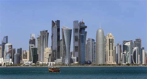 The skyline of Doha's West Bay high rise buildings, in Doha, Qatar ...