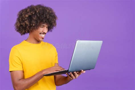 Happy African Man Standing and Using a Laptop Stock Photo - Image of manager, online: 267796084