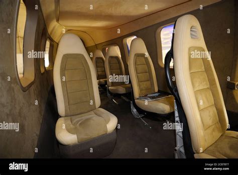 Interior of passenger helicopter salon, seats and window shades Stock Photo - Alamy