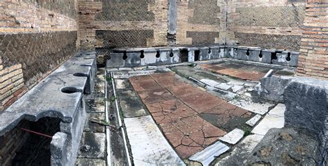 Ancient Roman public toilets, Ostia Antica, Italy : r/pics