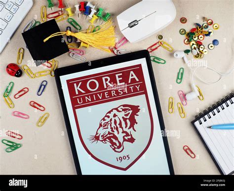 In this photo illustration, a Korea University logo seen displayed on a ...