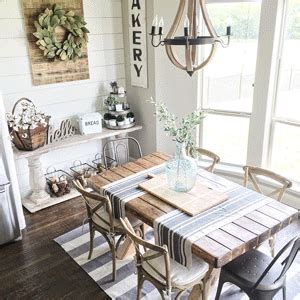 the dining room table is set with chairs and placemats, along with other decor items