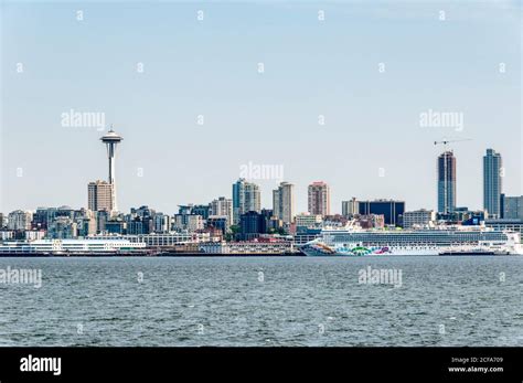 The Seattle skyline with the large Norwegian Cruise Line ship Norwegian ...