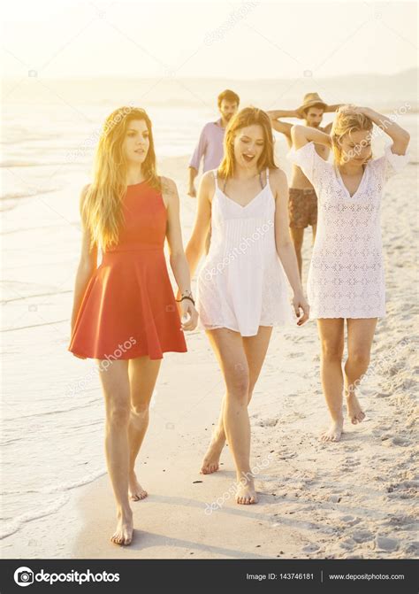 Friends walking along beach — Stock Photo © juripozzi #143746181