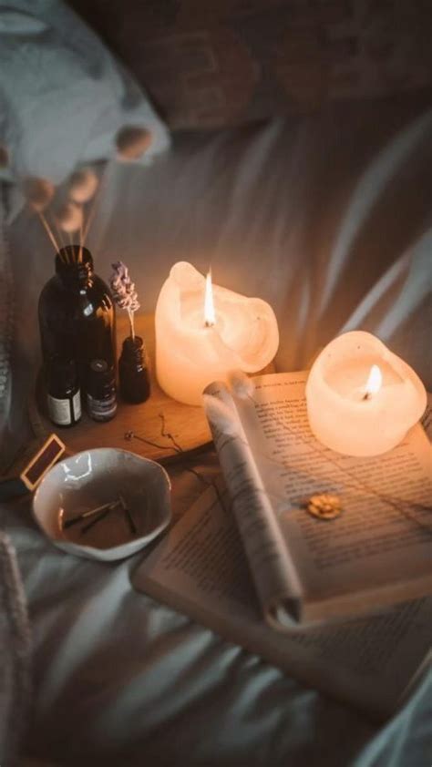 Cozy Fall Aesthetic with Lit Candles and a Book