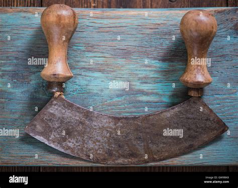 Vintage herb cutter and chopper on wooden board, copy space Stock Photo ...