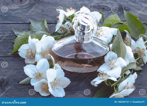 Bottle of Jasmine Flowers on Wooden Background. Jasmine Scented Perfume Stock Image - Image of ...