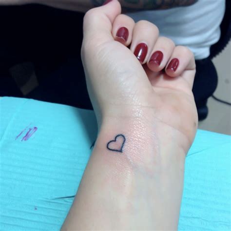 60 Hearts Tattoos For Wrists | Heart tattoo wrist, Small heart tattoos, Black heart tattoos