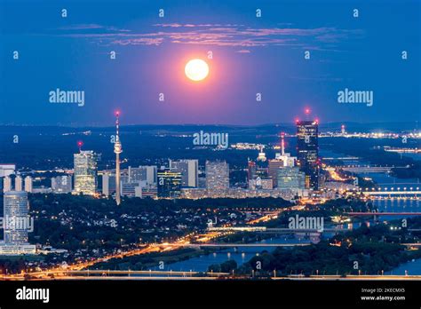 Vienna, full moon rise, super moon, view from mountain Leopoldsberg to Donaucity and river Donau ...