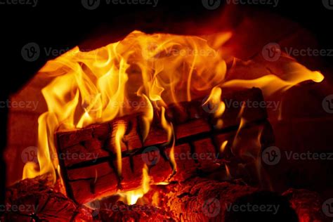 Burning log of wood in a fireplace close-up. 5392482 Stock Photo at Vecteezy