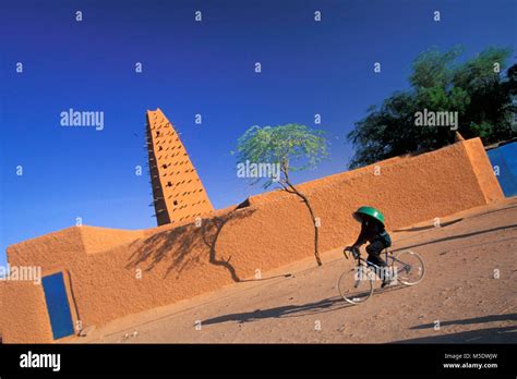 Niger. Agadez. Sahara desert. Sahel. Mosque. Cyclist. Unesco, World ...