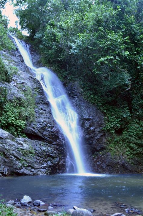 Immerse yourself in a coastal Biausevu Fiji waterfall as you explore the Fiji jungle ...