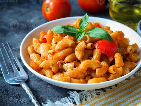 Macaroni pasta with tomato sauce 12041614 Stock Photo at Vecteezy