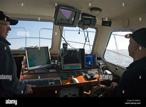 Steersman on command bridge with navigational instruments Kattegat Sea Scandinavia Stock Photo ...