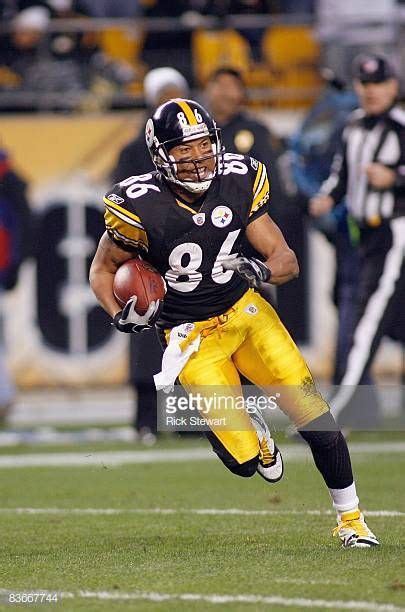 Hines Ward of the Pittsburgh Steelers carries the ball during the game ...