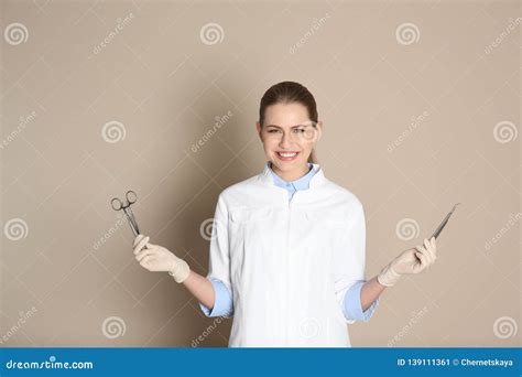 Female Dentist Holding Professional Tools Stock Image - Image of person ...