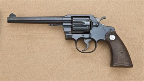 Colt Official Police, .38 special caliber double-action revolver with factory heavy 6” barrel, blu