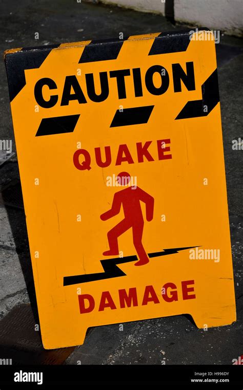 Caution earthquake damage sign Stock Photo - Alamy