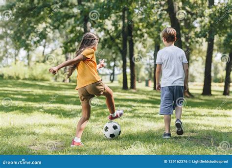 Back View of Children Playing with Soccer Ball Stock Photo - Image of preteen, male: 129162376