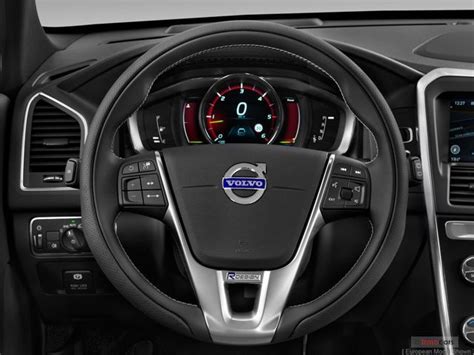 the steering wheel and dashboard of a car with an electronic display on ...