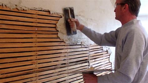 Traditional Lime plaster on laths, first coat of lime plaster onto a ...