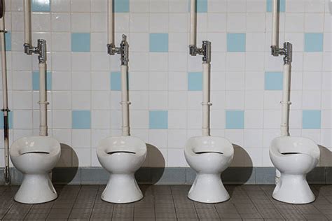 Girls Using Urinals Stock Photos, Pictures & Royalty-Free Images - iStock