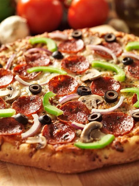 Supreme Italian Pizza with Pepperoni and Toppings Stock Photo - Image ...