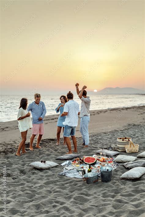 Friends Having Beach Party Stock Photo | Adobe Stock