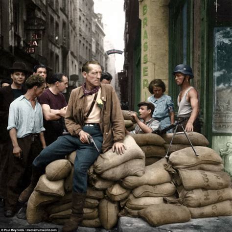 [COLOR] French Resistance fighters man a barricade in Paris in August ...