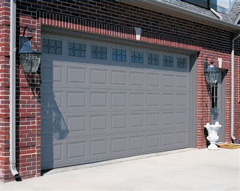 Red Brick House With a Garage Door And Front Door Color Gray And ... | front door | Pinterest ...