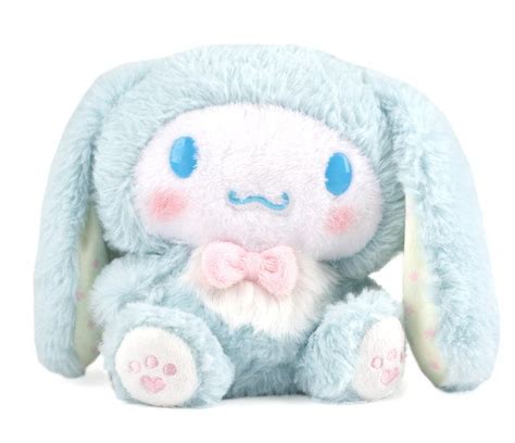 a blue stuffed animal with a pink bow tie on it's head and eyes