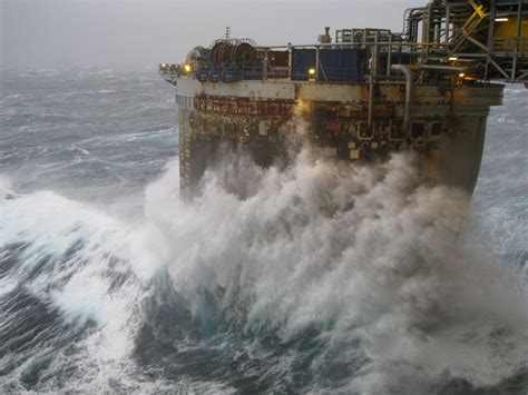 A storm at sea from the view of an oil rig : r/pics