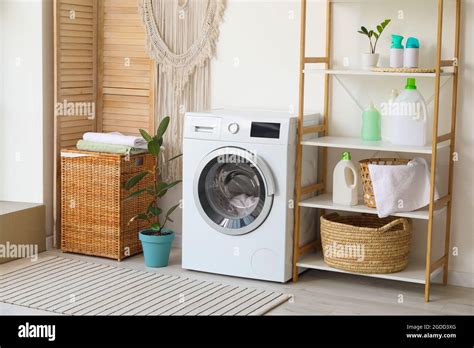 Interior of bathroom with modern washing machine Stock Photo - Alamy