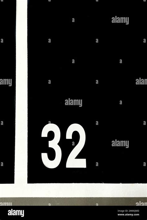 Parking numbers on a parking lot floor. Free space available. Park numbering on parking-lot ...