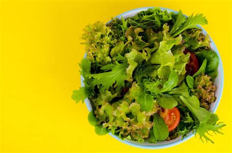 Bowl of mixed salad on bright, color background. 5432576 Stock Photo at Vecteezy