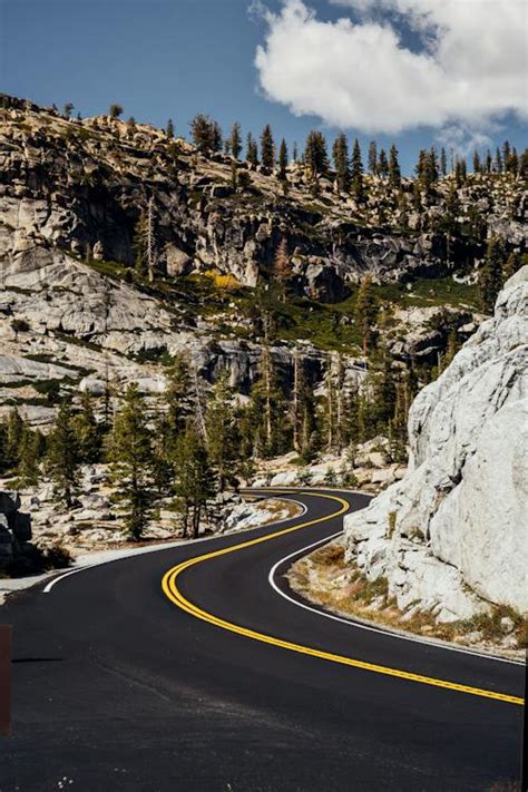 Winding Road Along Rocky Mountains · Free Stock Photo