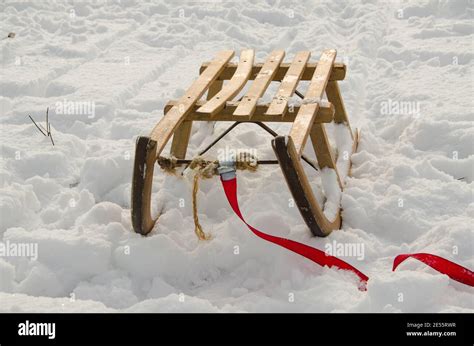 Wooden sledge in the snow Stock Photo - Alamy