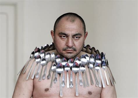 The Guinness World Record for "Most spoons on a human body" belongs to Etibar Elchiyev. Here he ...