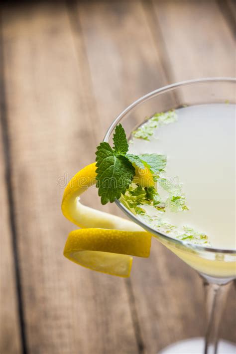 Yellow Martini Cocktail with Lemon and Mint Stock Photo - Image of beverage, vodka: 72398044