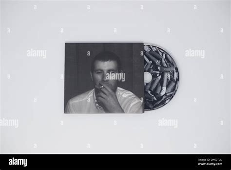 Arctic Monkeys - Whatever people say I am, that’s what I’m not album with CD on white background ...