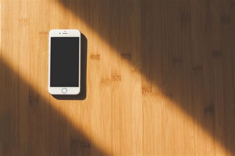 White Apple Iphone on Wooden Table · Free Stock Photo