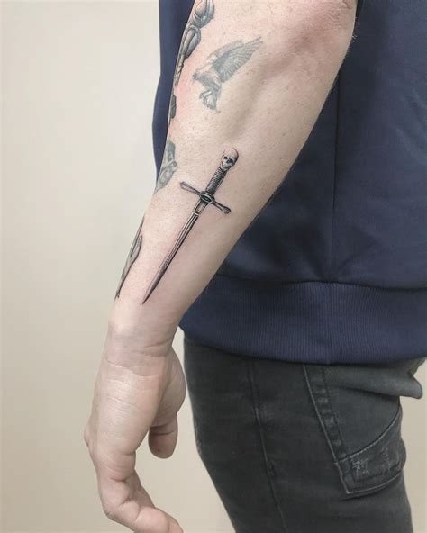 Little sword tattoo inked on the left forearm by Mr.Gulliver | Sword tattoo, Black ink tattoos ...