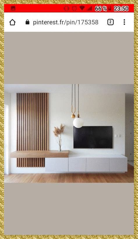 a large flat screen tv mounted to the side of a wall in a living room