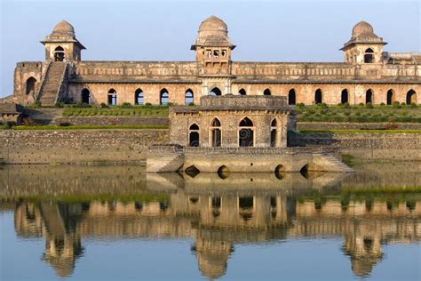 Jahaz Mahal , Ship Palace and Blue Water Lake in Sunrise. Mandu, Madhya Pradesh, India Stock ...