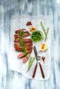 Sliced grilled fillet steak and vegetables - Free Stock Image