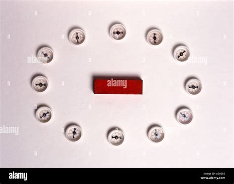 plotting compasses round a bar magnet Stock Photo: 131682 - Alamy