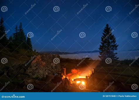 Campfire Under Blue Night Sky Stock Photo - Image of burning, hill ...