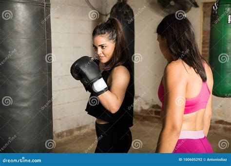 Woman in a boxing class stock photo. Image of punching - 100605292