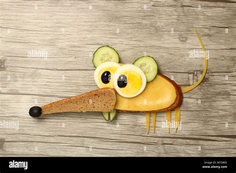 Mouse made with food ingredients on wooden background Stock Photo - Alamy